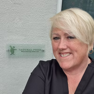 Photo of Sally outside the Natural Poise Clinic